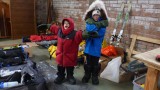 Lennie (left) and Rex Quail, testing some of the clothing in ALE's
warehouse. They are here in Punta with their parents, Greg (Pole to Pole
Run manager and producer) and Lisbeth.